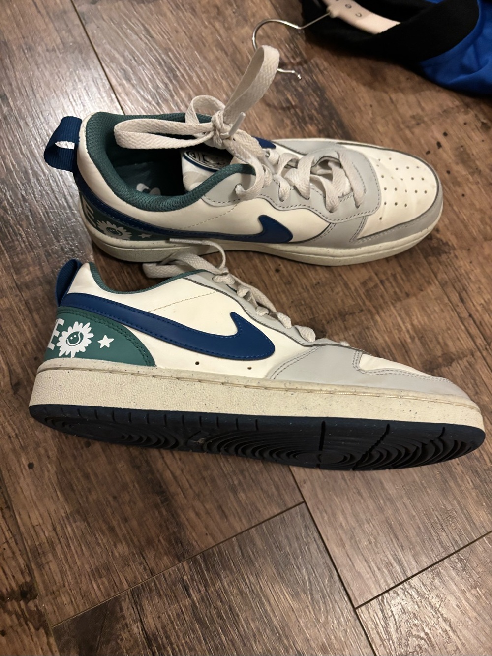 Nike White Sneakers with Blue Swoosh & Green Heel Floral Detail